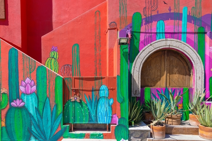 Colorful painting in the front of a colonial building, in Cabo San Lucas centric zone.