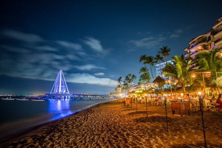 Puerto Vallarta at night by the seashore.