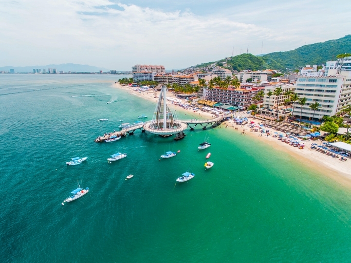 Aerial view of Puerto Vallarta, with ships around the cruise port.